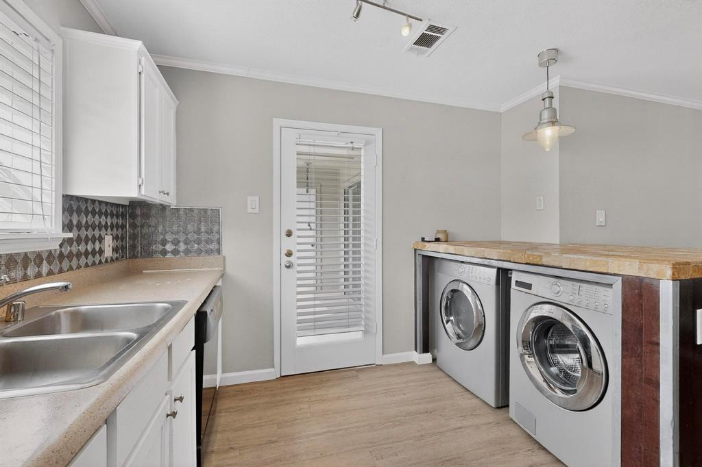 5335 Bent Tree Forest Drive, Unit 237 Dallas, TX 75248 - Photo 13 of 33 a utility room with sink dryer and washer