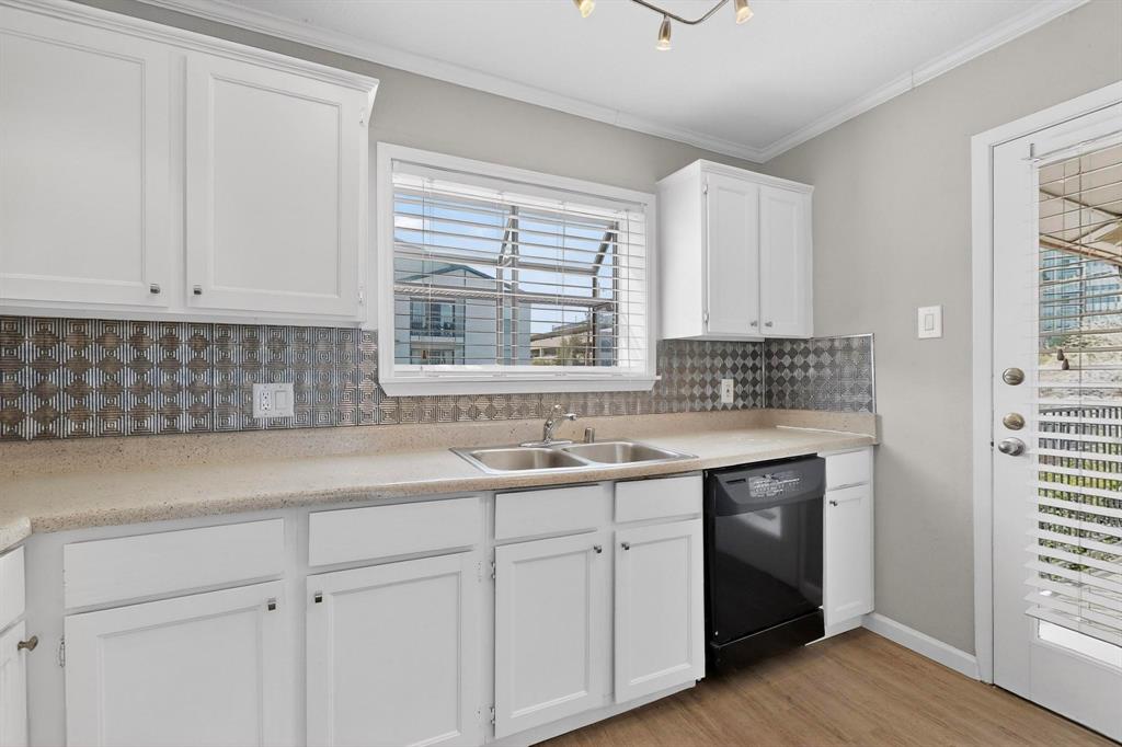 5335 Bent Tree Forest Drive, Unit 237 Dallas, TX 75248 - Photo 15 of 33 a kitchen with a sink cabinets and window