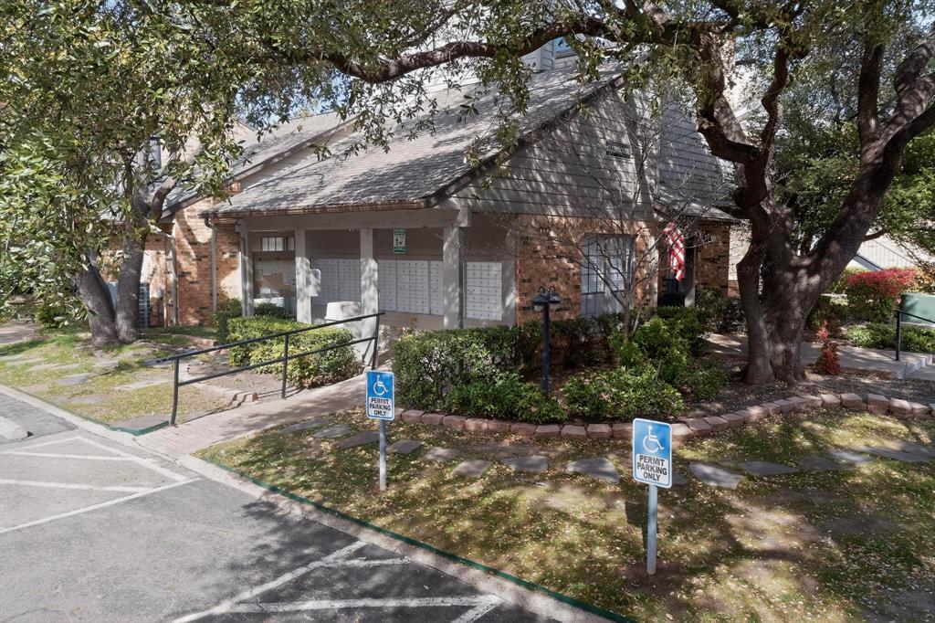 5335 Bent Tree Forest Drive, Unit 237 Dallas, TX 75248 - Photo 31 of 33 a front view of a house with a yard