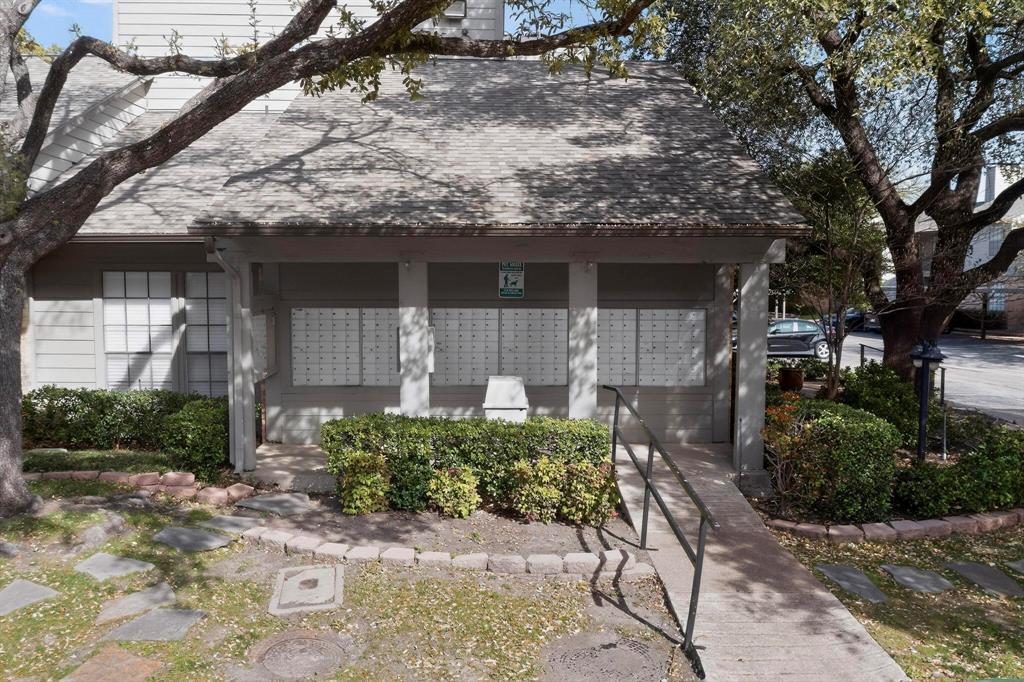 5335 Bent Tree Forest Drive, Unit 237 Dallas, TX 75248 - Photo 32 of 33 a front view of a house with a yard