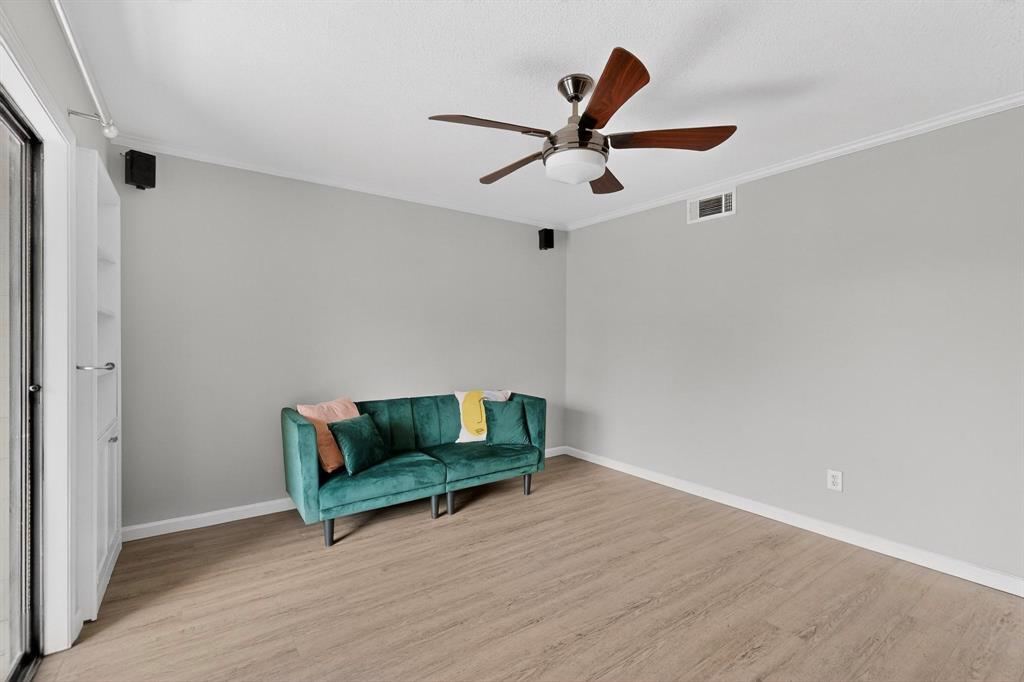 5335 Bent Tree Forest Drive, Unit 237 Dallas, TX 75248 - Photo 6 of 33 a living room with furniture and a ceiling fan