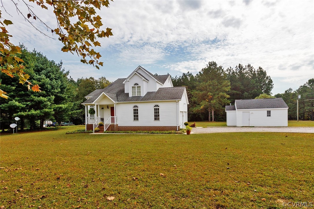 17301 Loving Union Road Disputanta, VA 23842 - Photo 2 of 31 a front view of a house with a yard