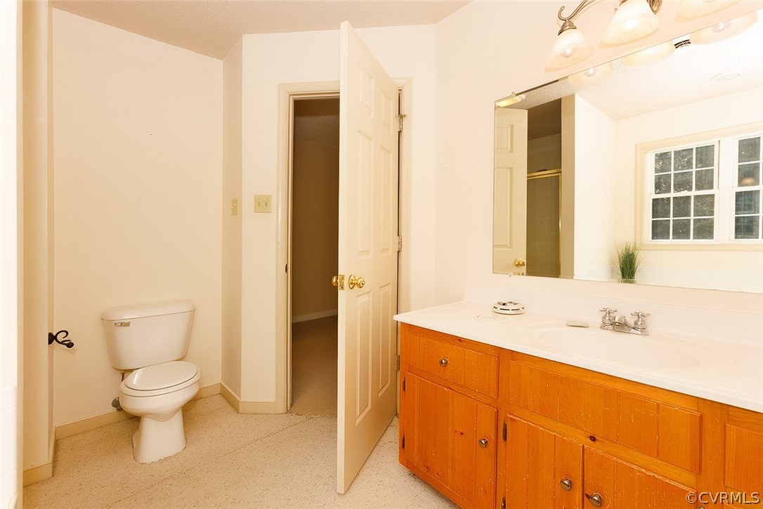 17301 Loving Union Road Disputanta, VA 23842 - Photo 23 of 31 a bathroom with a sink and a large mirror