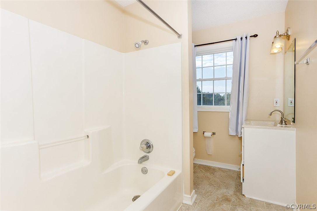 17301 Loving Union Road Disputanta, VA 23842 - Photo 27 of 31 a bathroom with a bathtub and a shower