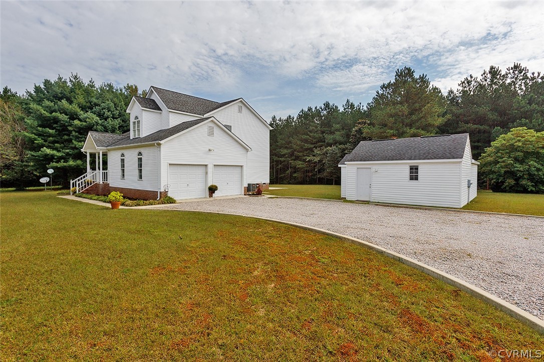 17301 Loving Union Road Disputanta, VA 23842 - Photo 3 of 31 a house view with a garden space