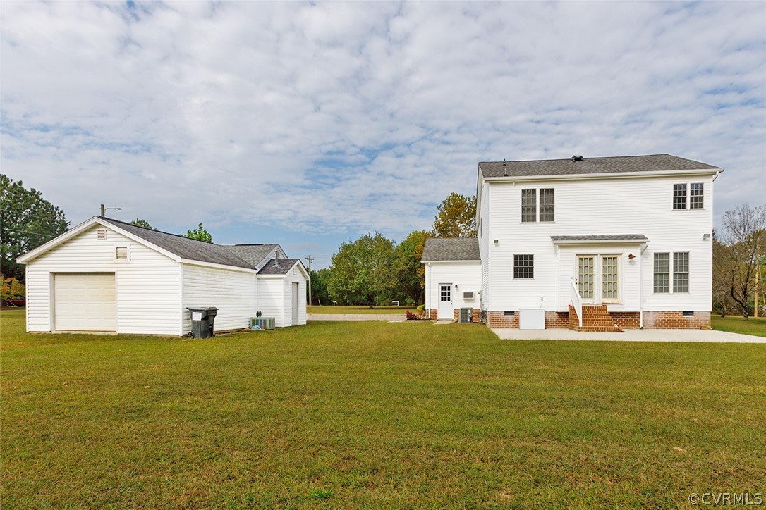 17301 Loving Union Road Disputanta, VA 23842 - Photo 4 of 31 a big white house with a big yard and large trees