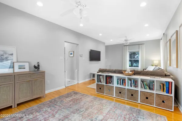 a living room with a large window and a flat screen tv