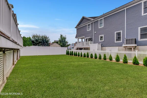 a view of house with a yard