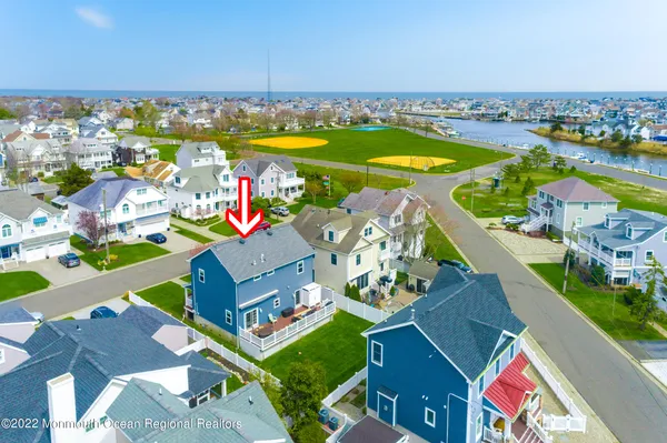 an aerial view of a house with a ocean view