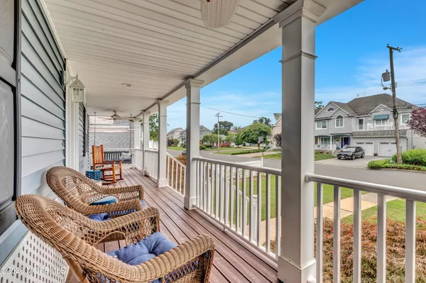 a balcony with furniture and a rug