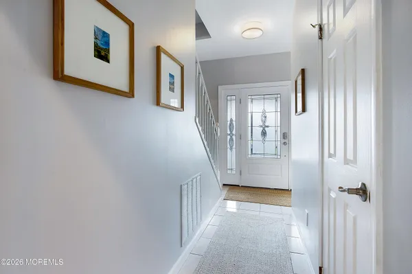 a view of a hallway with windows