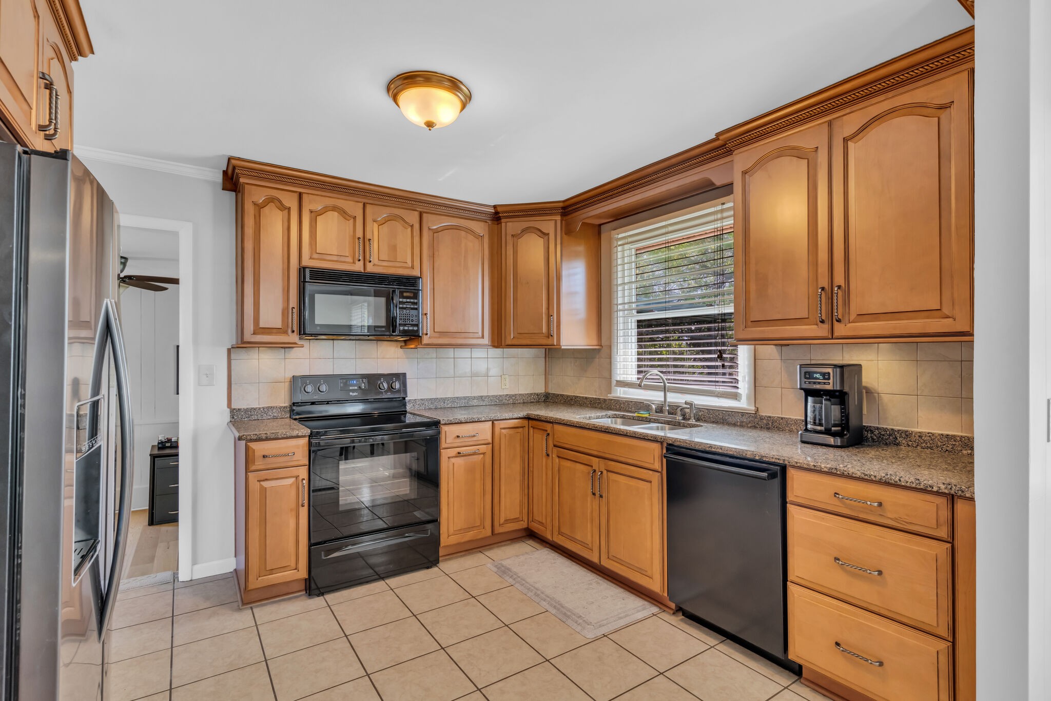 410 Gates Road Goodlettsville, TN 37072 - Photo 11 of 31 a kitchen with stainless steel appliances granite countertop a stove sink and cabinets