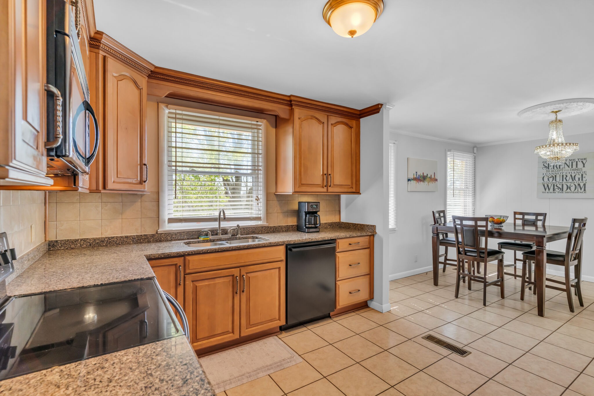 410 Gates Road Goodlettsville, TN 37072 - Photo 13 of 31 a kitchen with stainless steel appliances granite countertop a sink and a stove
