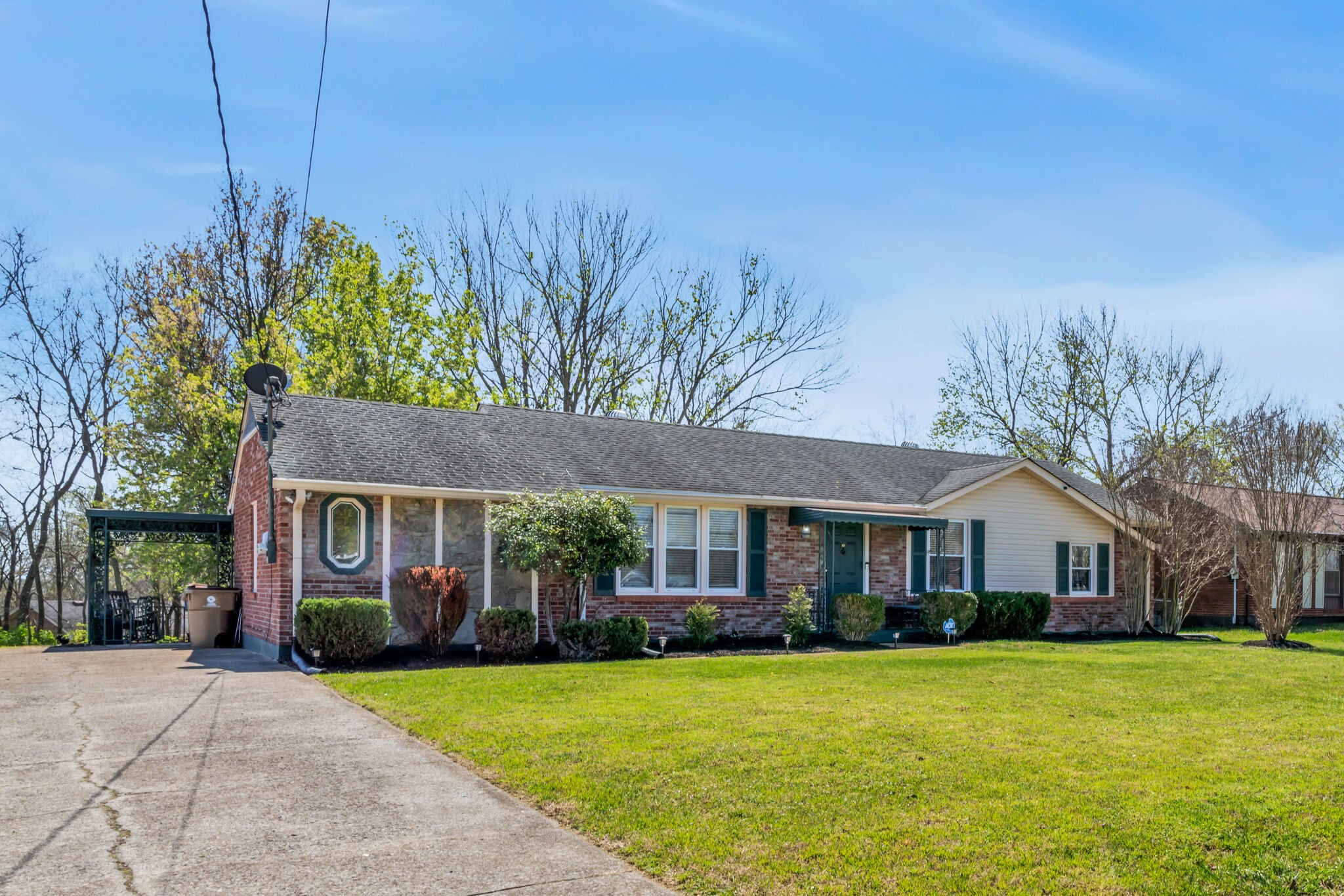 410 Gates Road Goodlettsville, TN 37072 - Photo 3 of 31 a front view of a house with a garden and porch