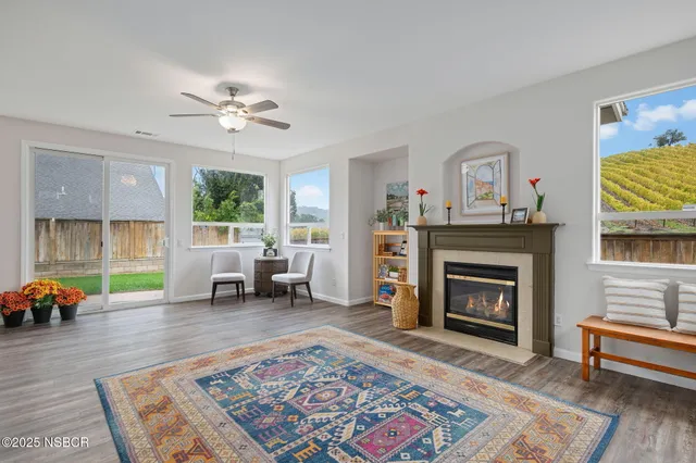 a large kitchen with stainless steel appliances granite countertop a stove granite counter tops and a view of living room