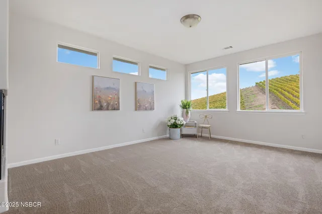 a bedroom with bed and a window