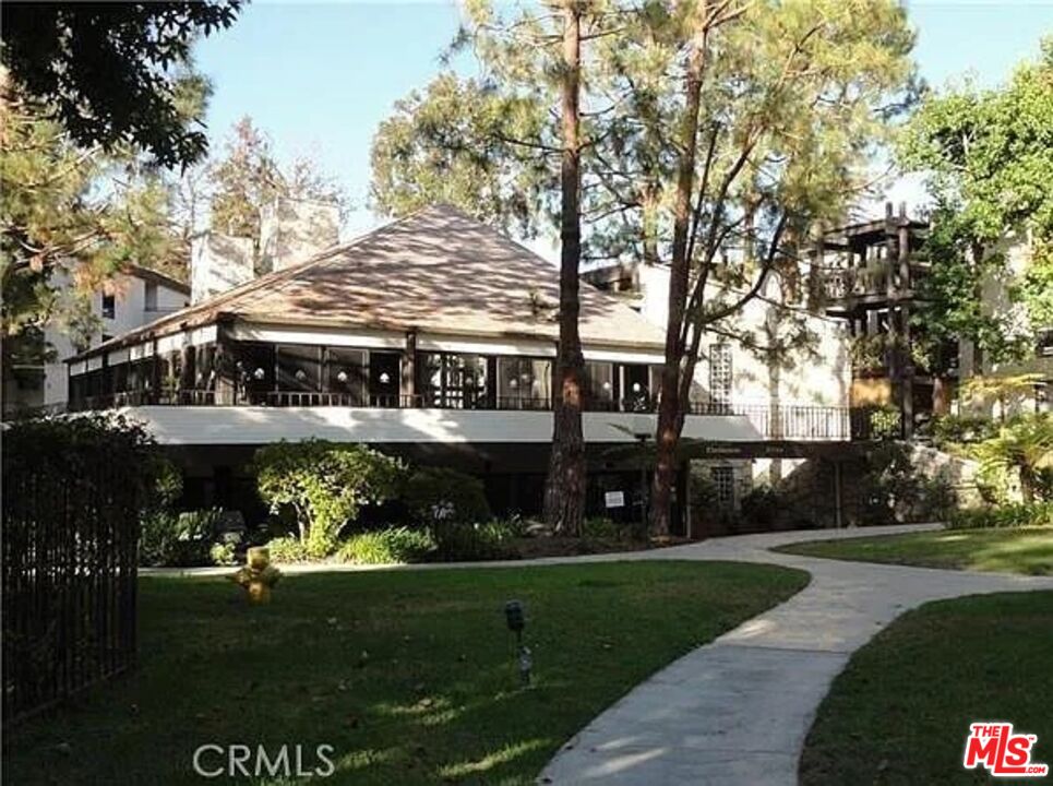 7777 West 91st Street, Unit E2143 Playa del Rey, CA 90293 - Photo 17 of 21 a view of house with a garden and pathway