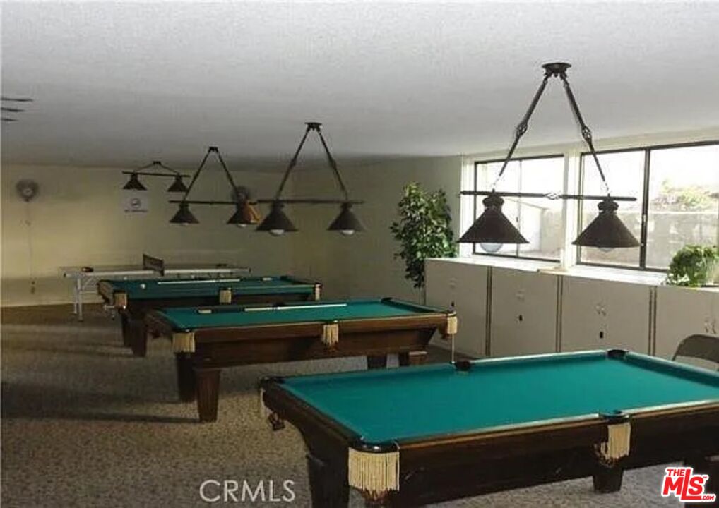 7777 West 91st Street, Unit E2143 Playa del Rey, CA 90293 - Photo 19 of 21 a room with pool table and a potted plant