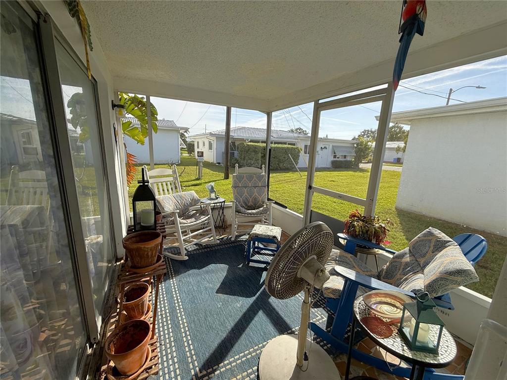 10171 45th Way Pinellas Park, FL 33782 - Photo 12 of 45 a view of a workspace with furniture and floor to ceiling window