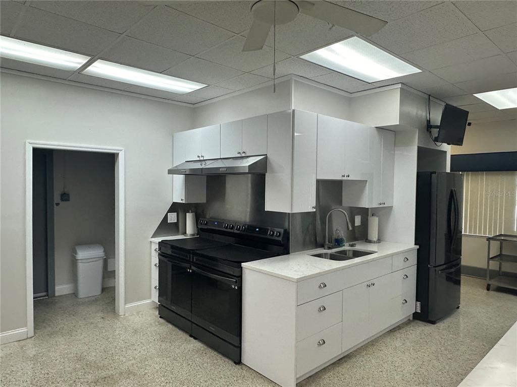 10171 45th Way Pinellas Park, FL 33782 - Photo 15 of 45 a kitchen with a sink and a stove top oven
