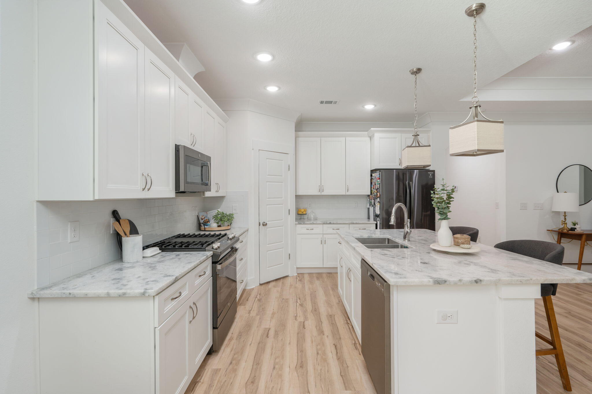667 Red Fern Road Crestview, FL 32536 - Photo 11 of 43 a kitchen with a sink stove top oven and refrigerator