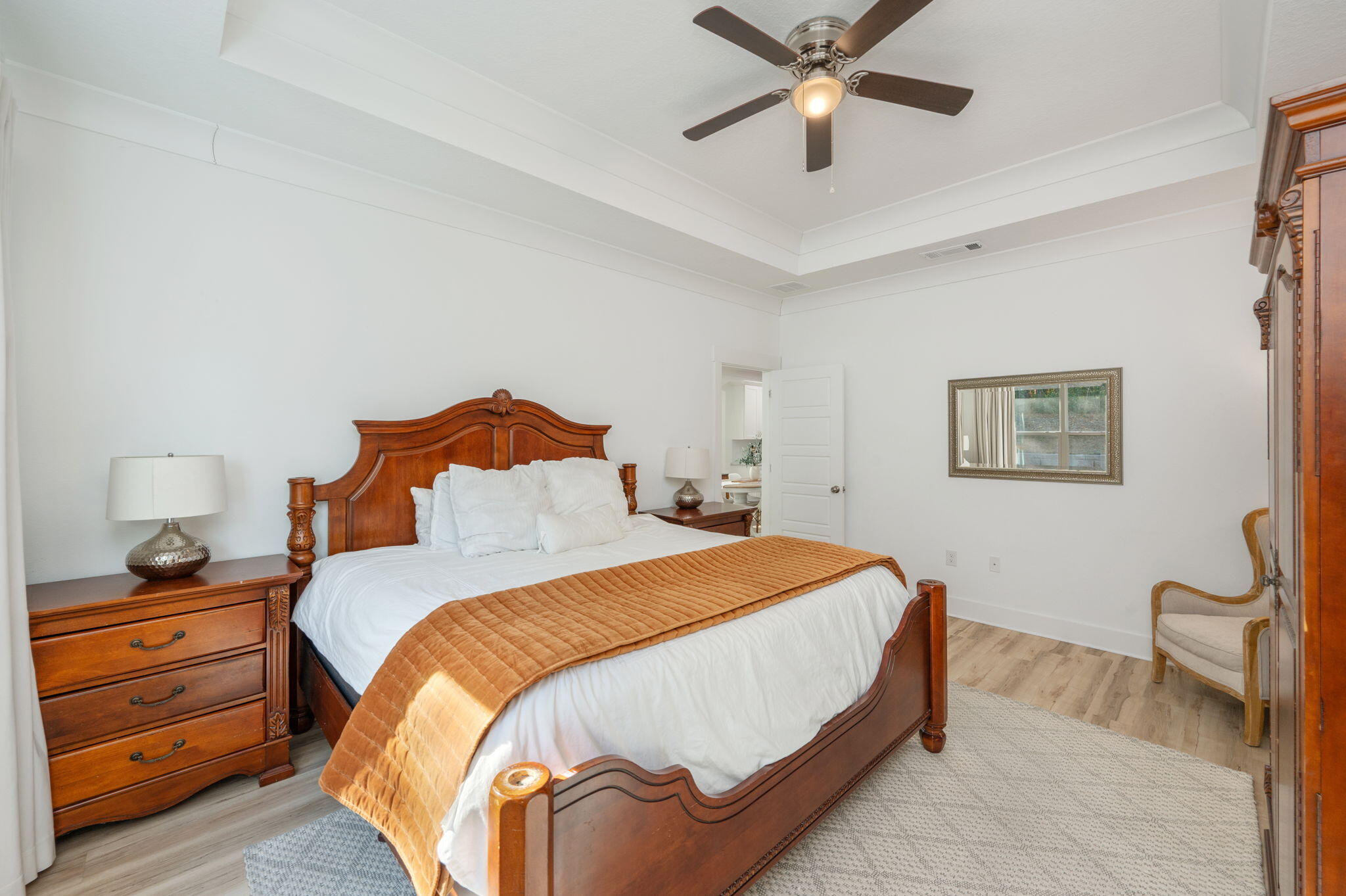 667 Red Fern Road Crestview, FL 32536 - Photo 16 of 43 a bedroom with a bed and a chandelier