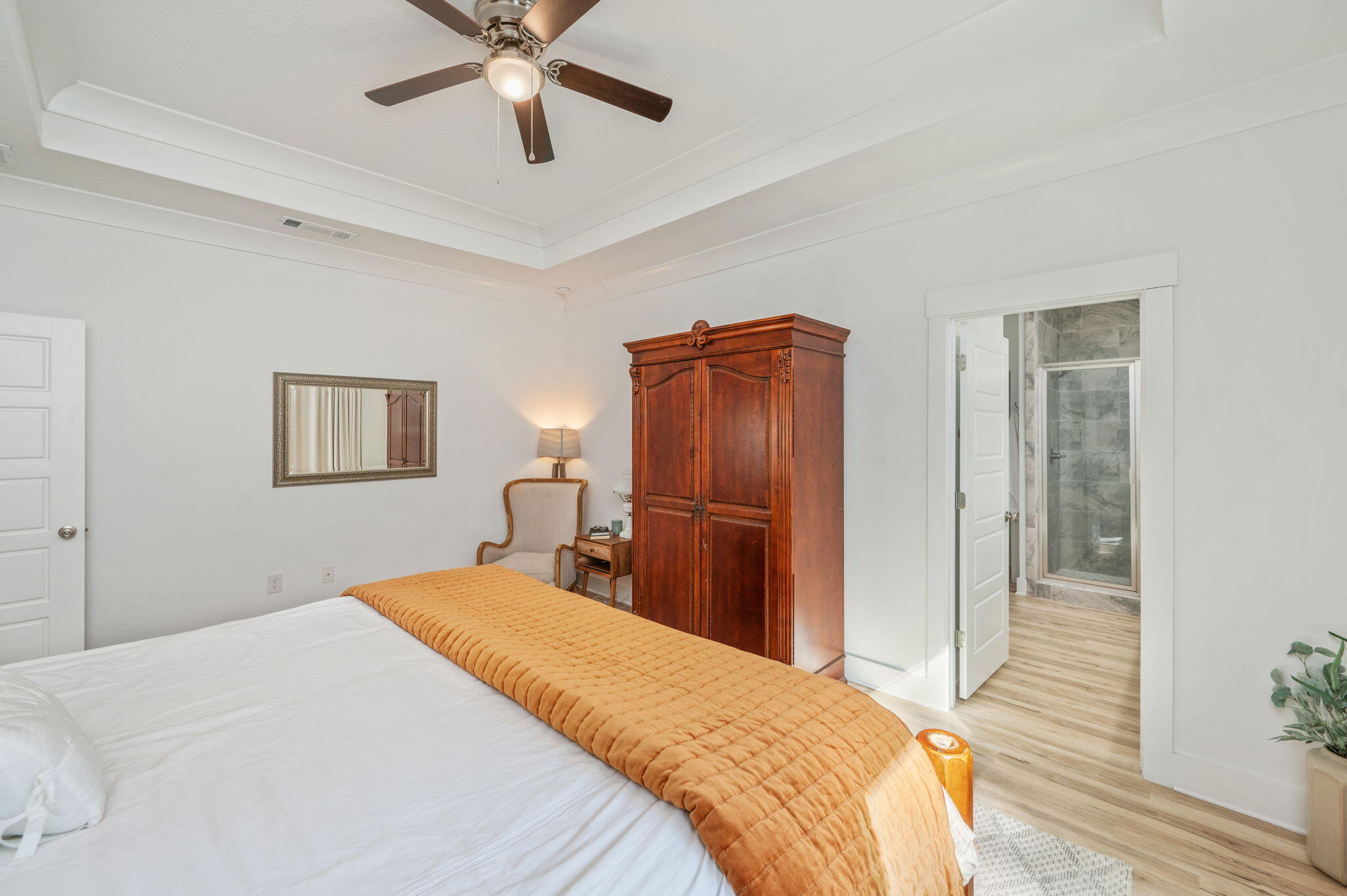 667 Red Fern Road Crestview, FL 32536 - Photo 17 of 43 a bedroom with a bed and a chandelier