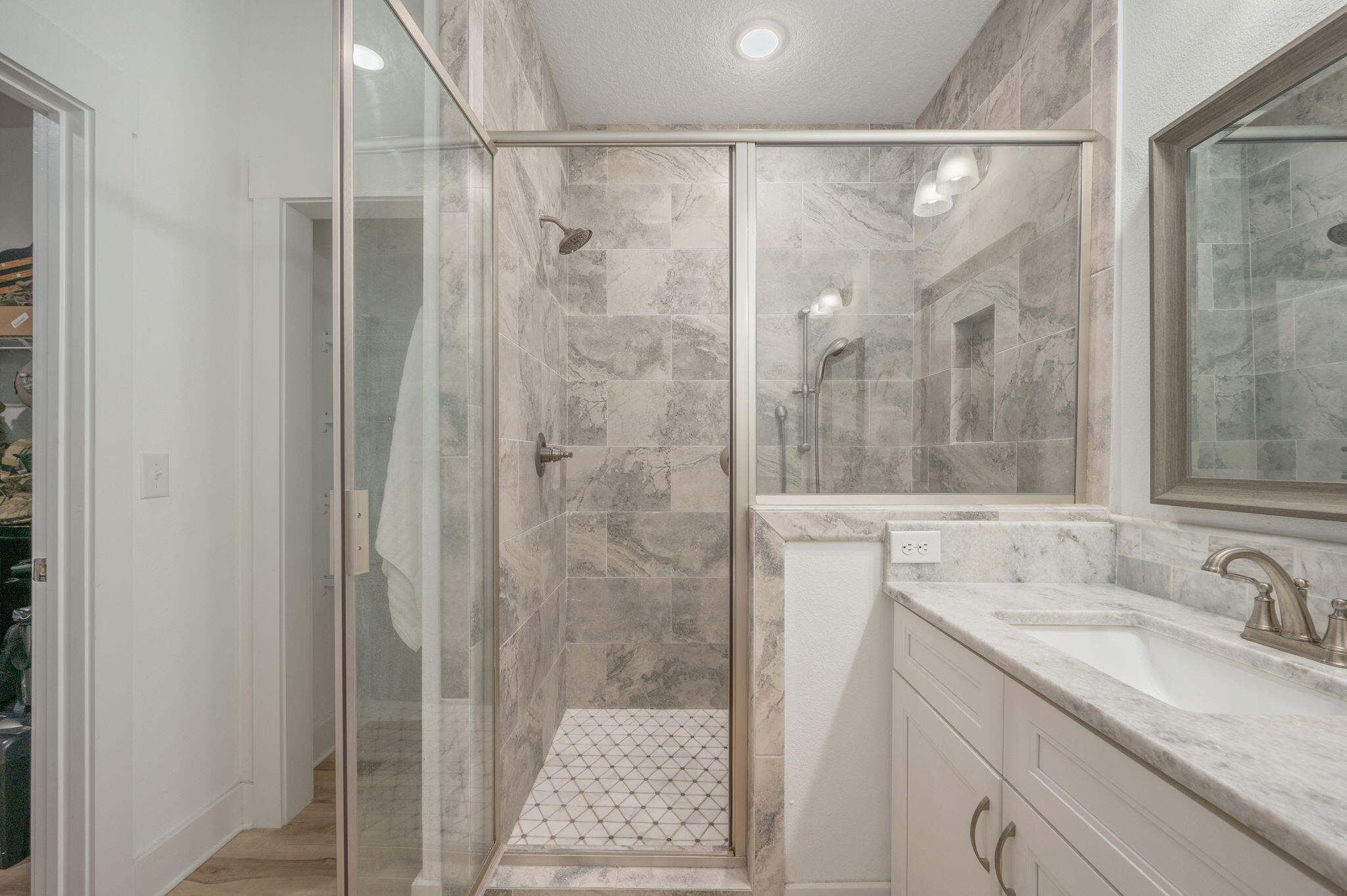 667 Red Fern Road Crestview, FL 32536 - Photo 19 of 43 a bathroom with a granite countertop shower sink vanity and mirror