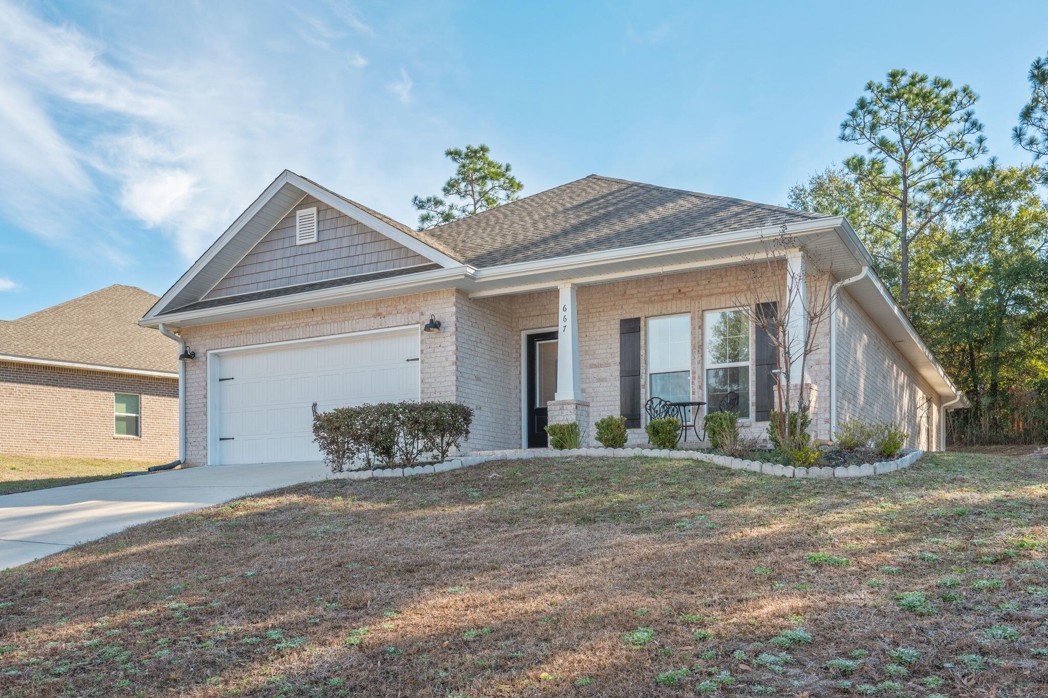 667 Red Fern Road Crestview, FL 32536 - Photo 2 of 43 a front view of a house with a yard