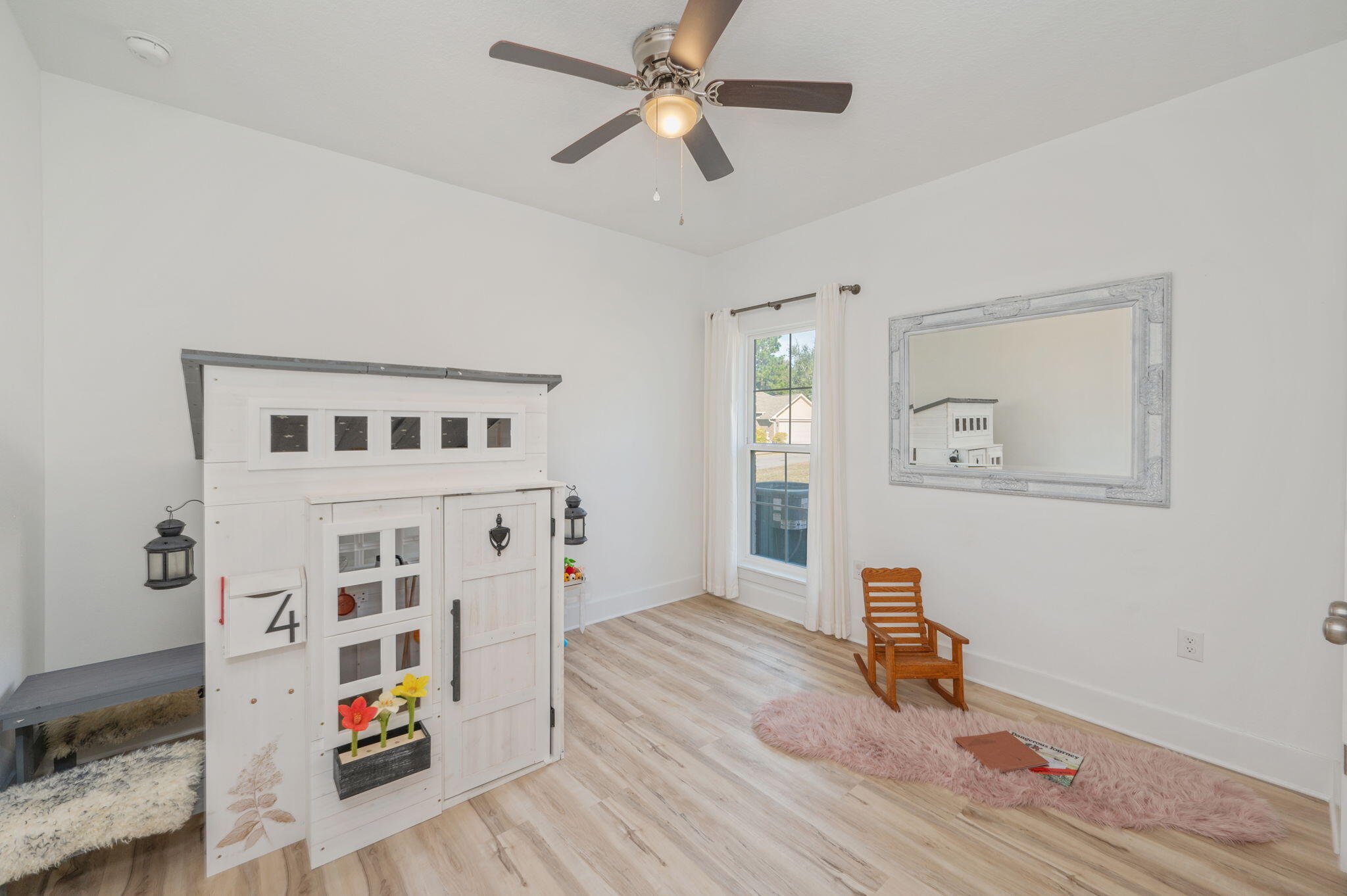 667 Red Fern Road Crestview, FL 32536 - Photo 24 of 43 a view of livingroom with hardwood floor and ceiling fan