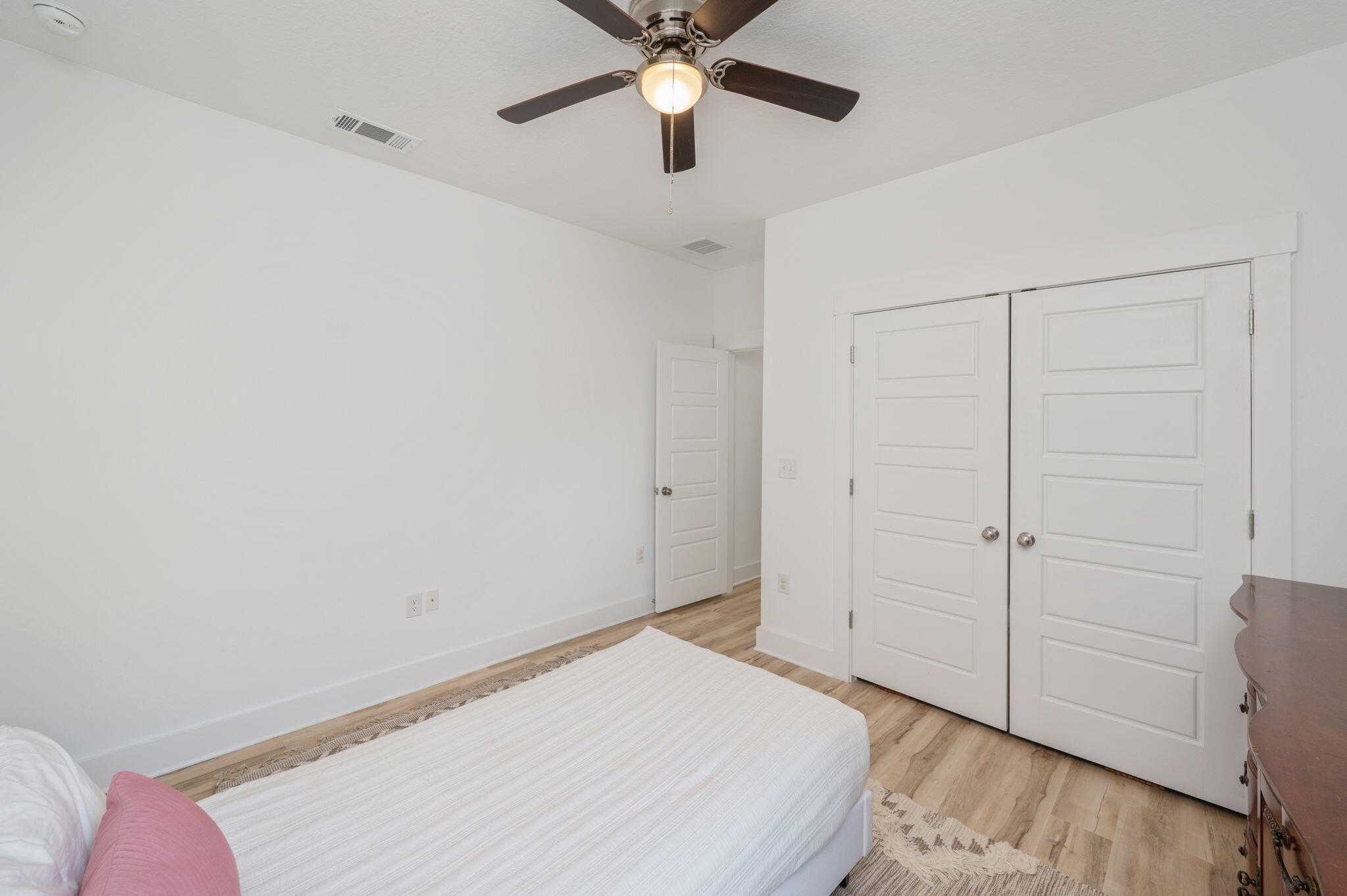 667 Red Fern Road Crestview, FL 32536 - Photo 27 of 43 a bedroom with a bed and a chandelier