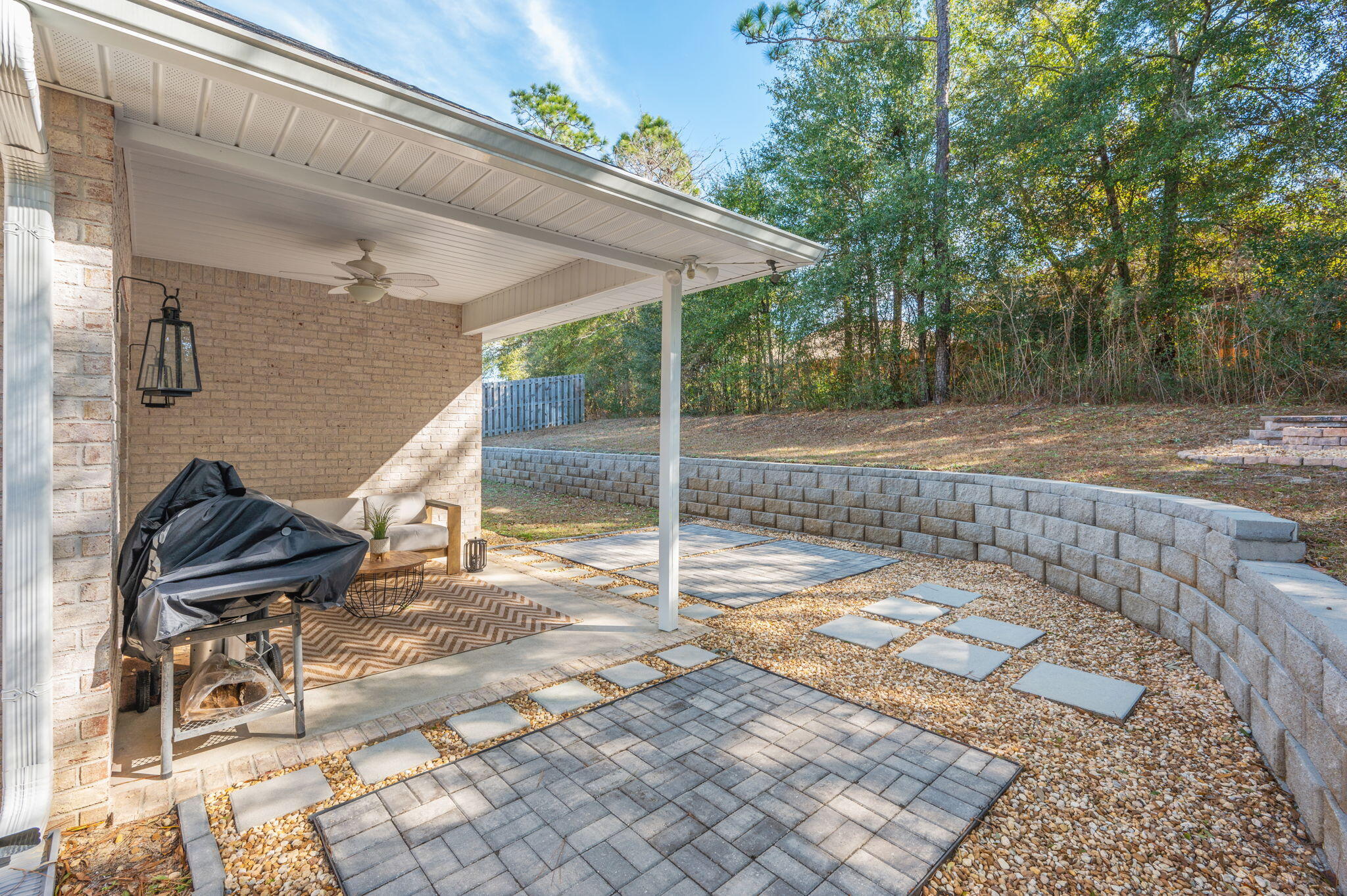 667 Red Fern Road Crestview, FL 32536 - Photo 32 of 43 a backyard of a house with table and chairs
