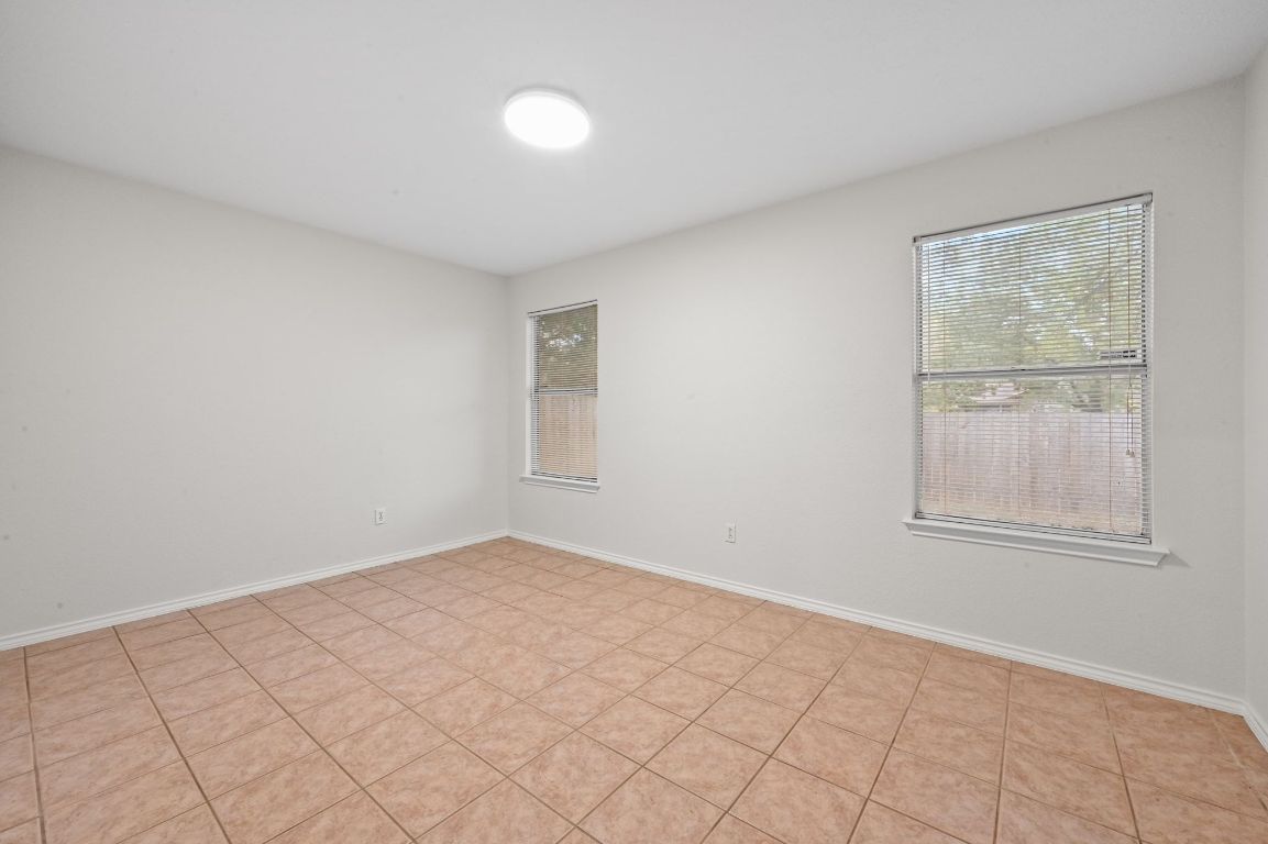 9711 Curlew Drive Austin, TX 78748 - Photo 14 of 21 an empty room with windows