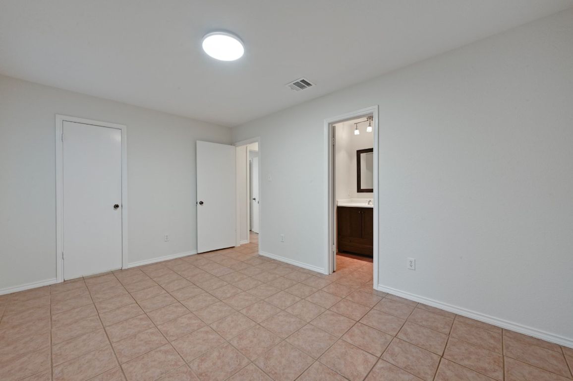 9711 Curlew Drive Austin, TX 78748 - Photo 15 of 21 a view of an empty room with a bathroom