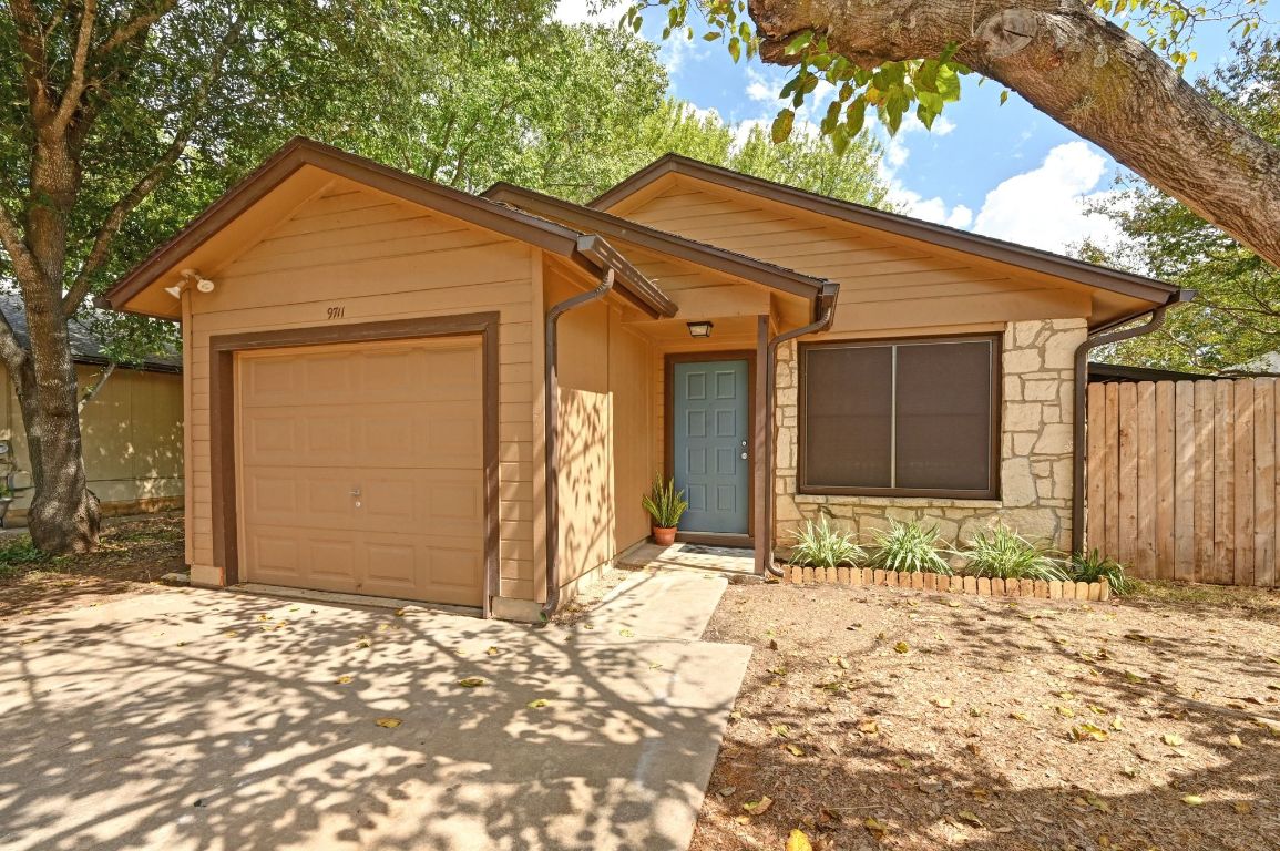 9711 Curlew Drive Austin, TX 78748 - Photo 2 of 21 a front view of a house