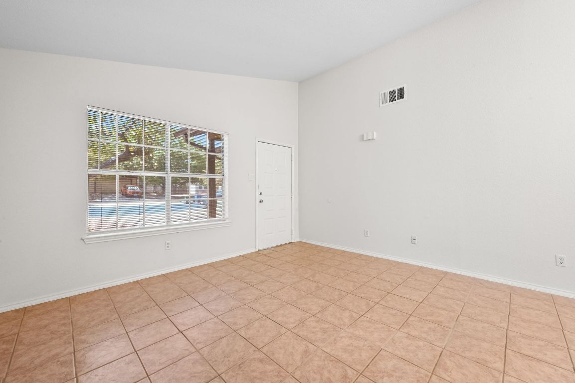 9711 Curlew Drive Austin, TX 78748 - Photo 4 of 21 an empty room with windows