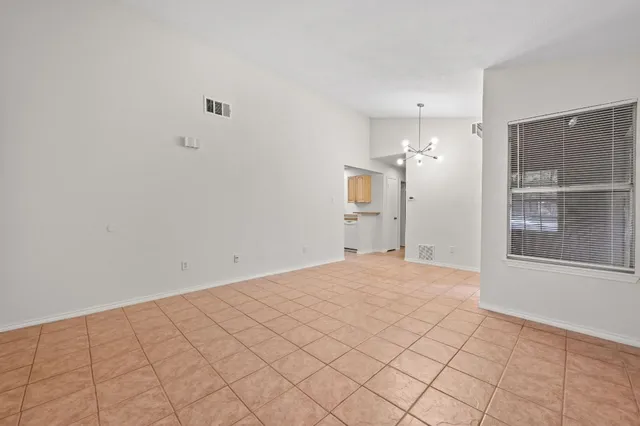 a view of empty room with windows