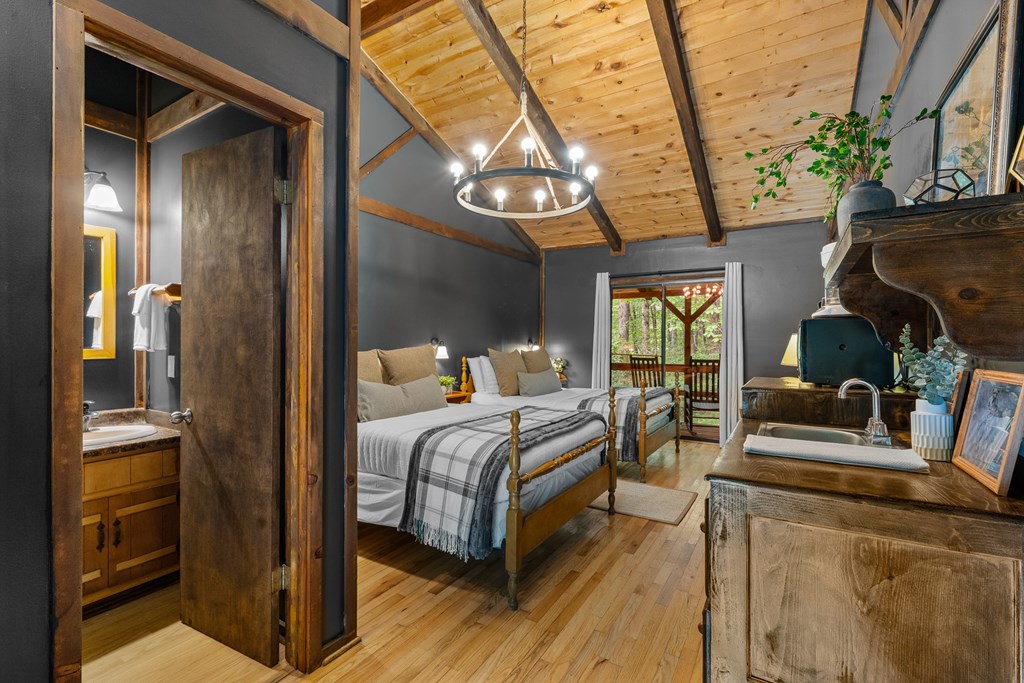 3573 Highway 356 Sautee Nacoochee, GA 30571 - Photo 32 of 53 a bedroom with bed and a large window