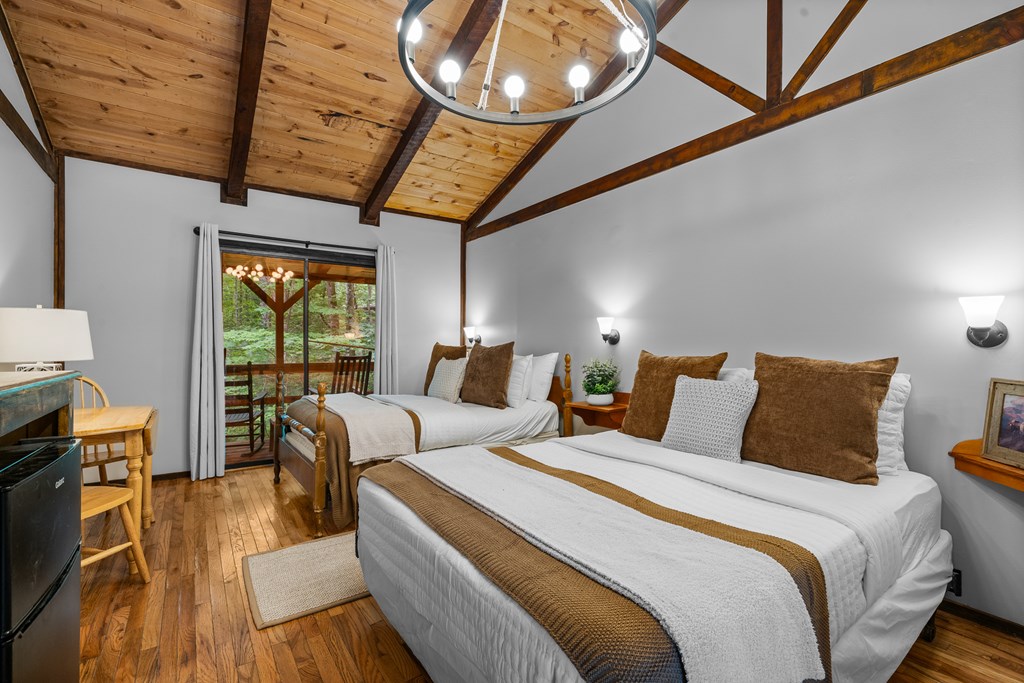 3573 Highway 356 Sautee Nacoochee, GA 30571 - Photo 46 of 53 a spacious bedroom with two beds and a large window