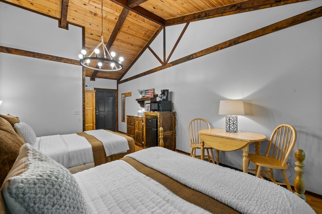 3573 Highway 356 Sautee Nacoochee, GA 30571 - Photo 48 of 53 a bedroom with two beds and chandelier