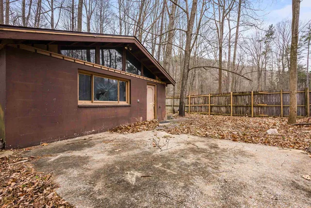 a house with trees in front of it