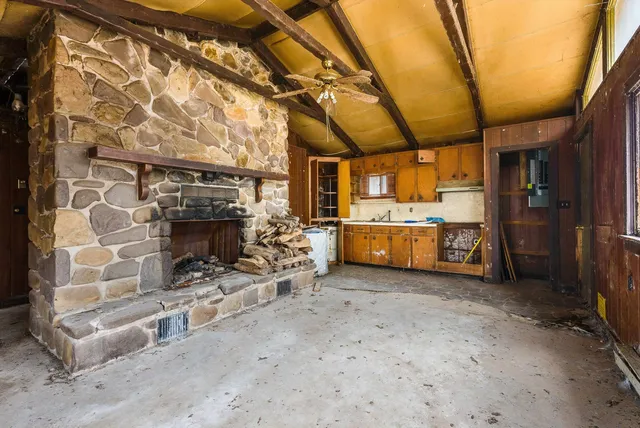 a view of fireplace and window