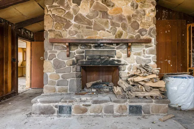 a view of a room with wooden walls