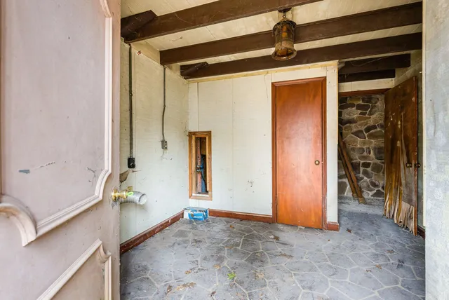 a view of a room that has a large window and closet