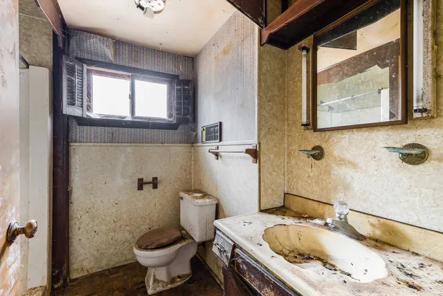 a bathroom with a shower and a sink