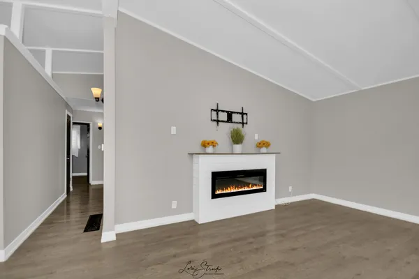 a room with a fireplace and a fireplace