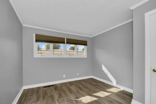a bathroom with a sink mirror and shower