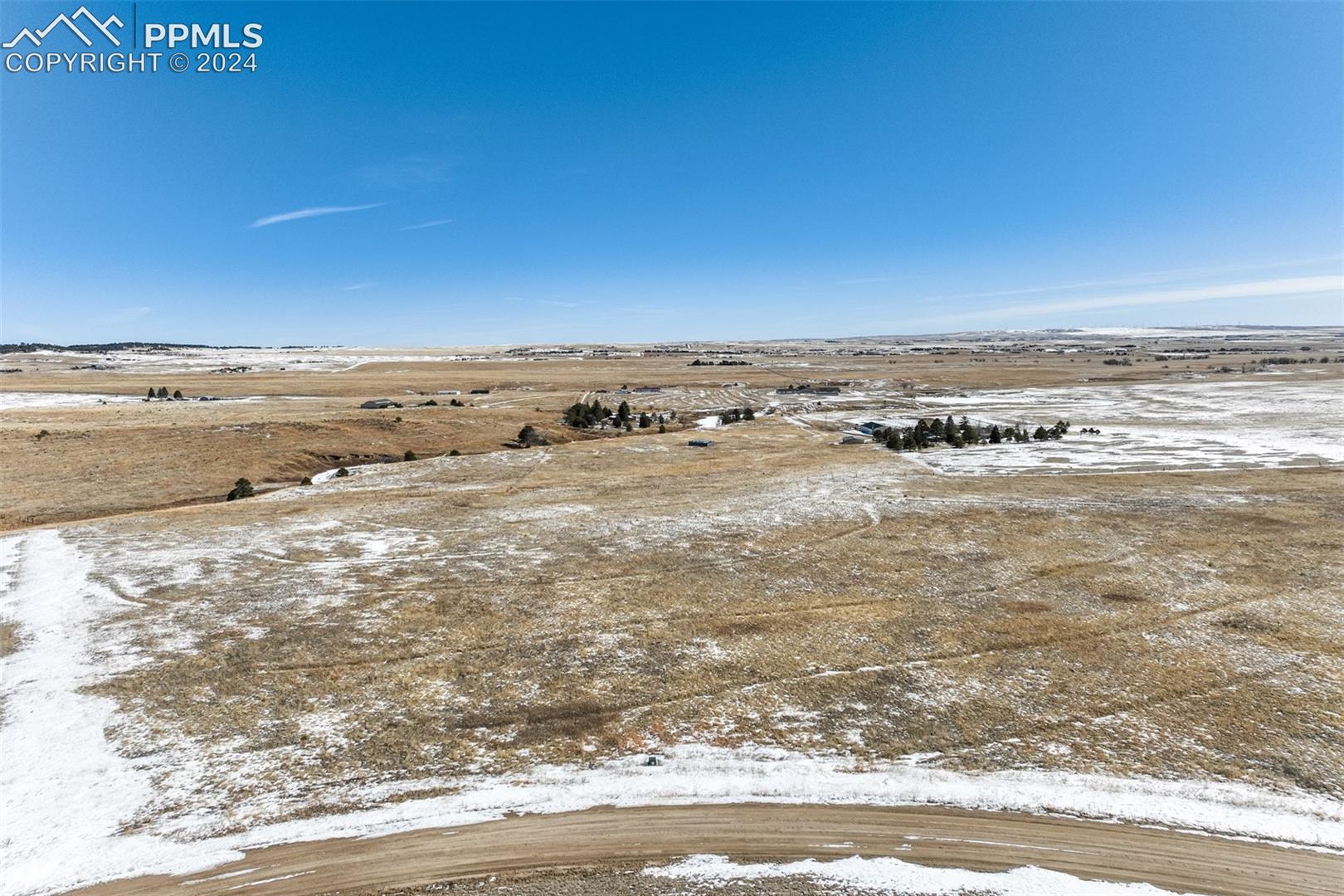 15770 Atlas Loop Peyton, CO 80831 - Photo 1 of 10 Yard covered in snow featuring a rural view
