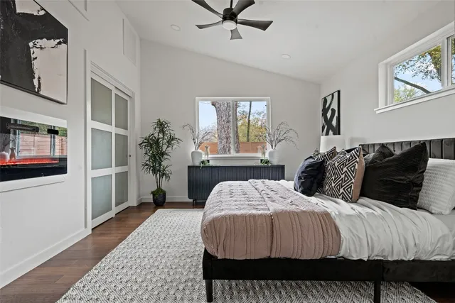 a bedroom with a large bed and a window