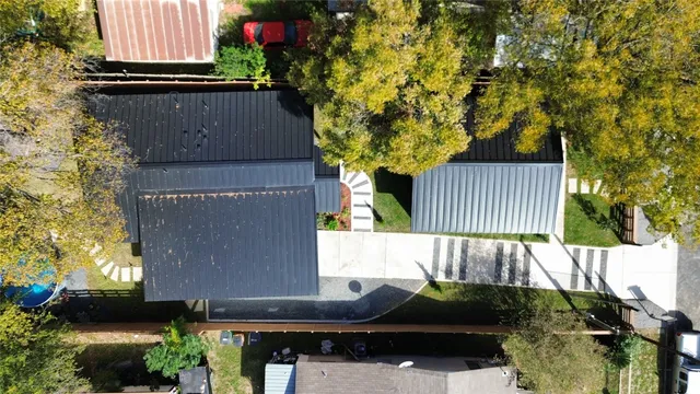 a view of a backyard with sitting area